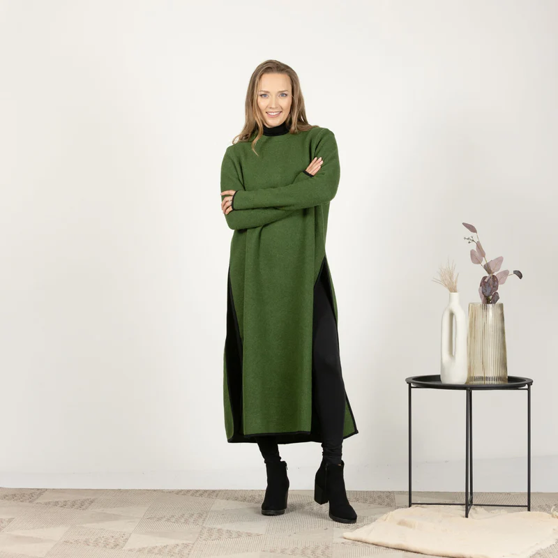Model in green wool winter sweater dress