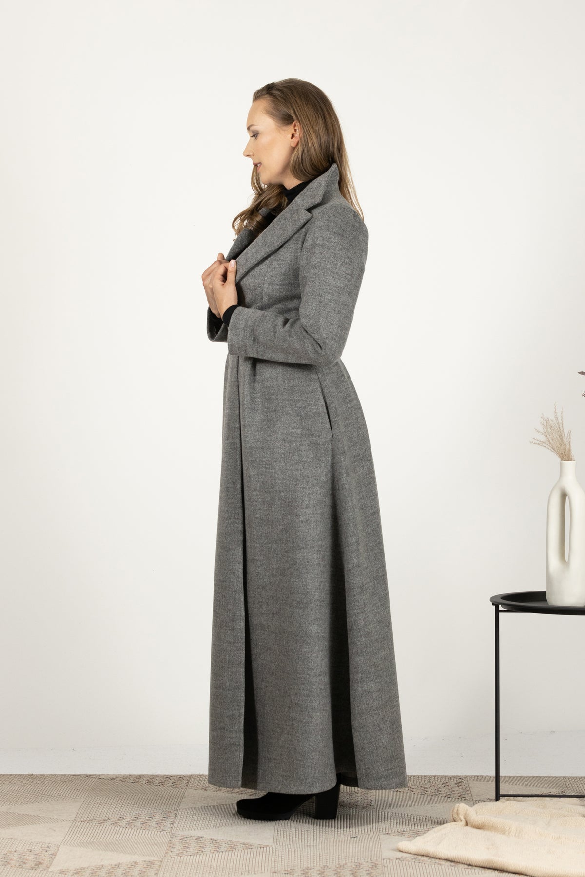 Side view of Elegant A-line wool coat with side pockets