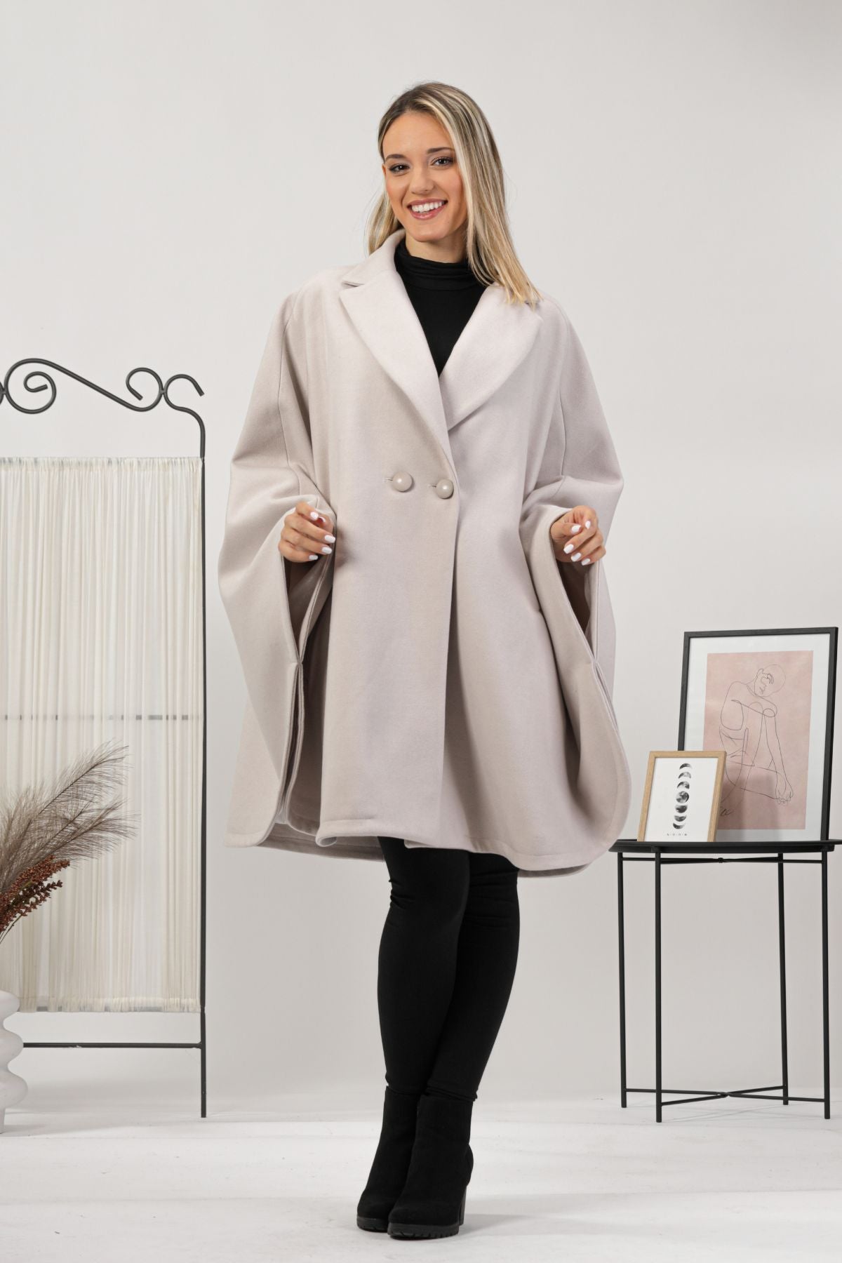 One-size off-white cape with relaxed drop shoulders