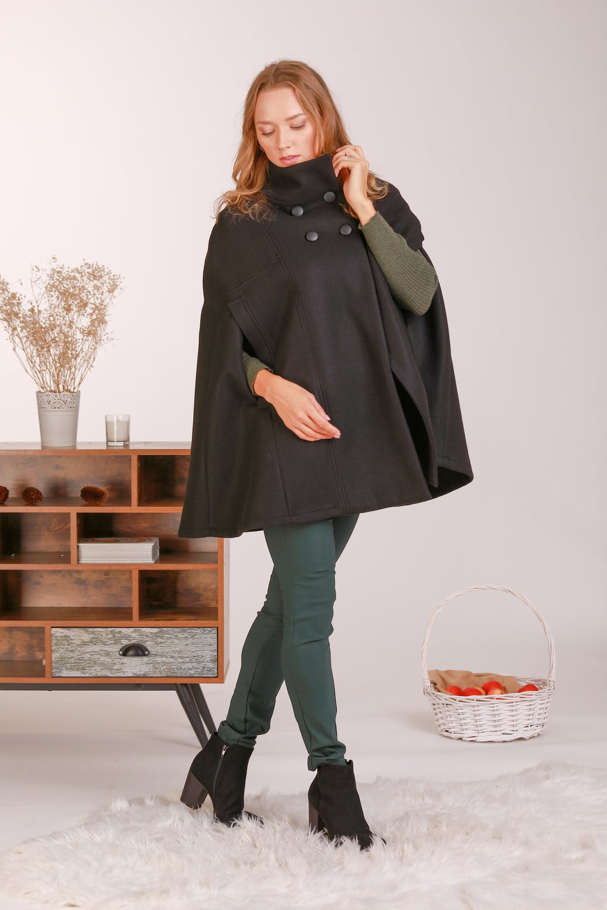 Stay warm in style with our Black Cape Coat - from NikkaPlace | Effortless fashion for easy living