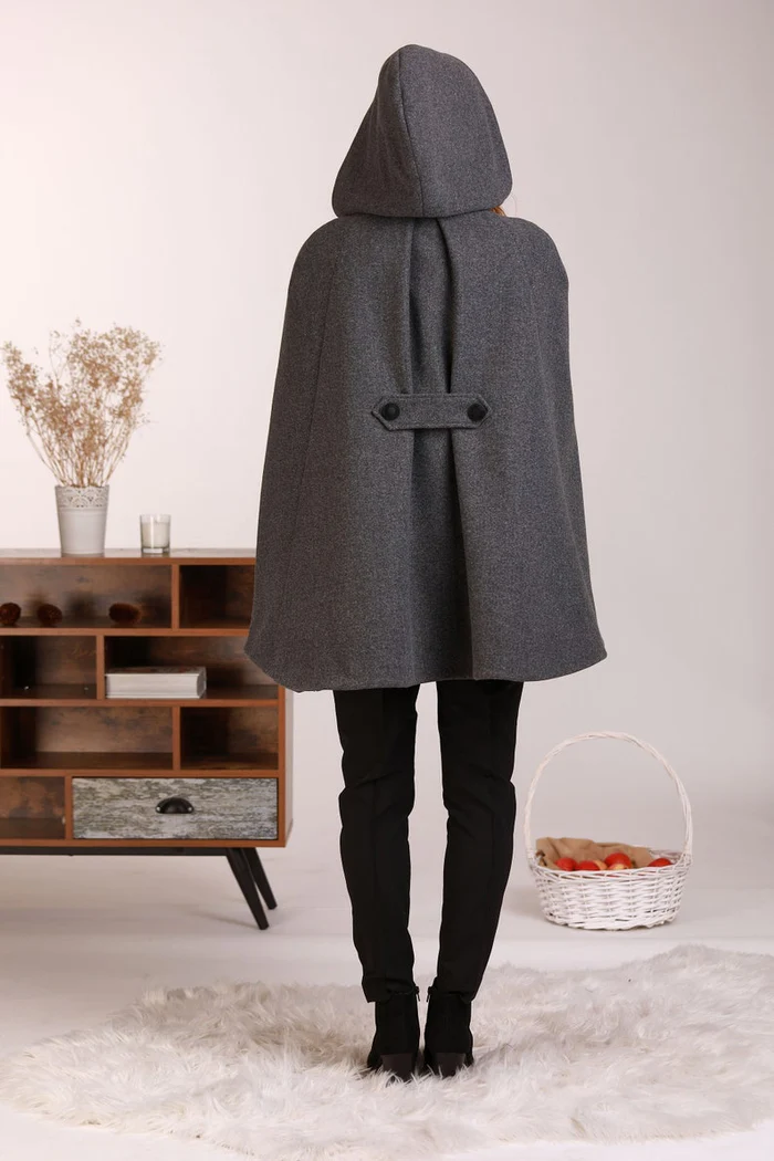 Back view of Hooded wool cape coat with elegant drape

