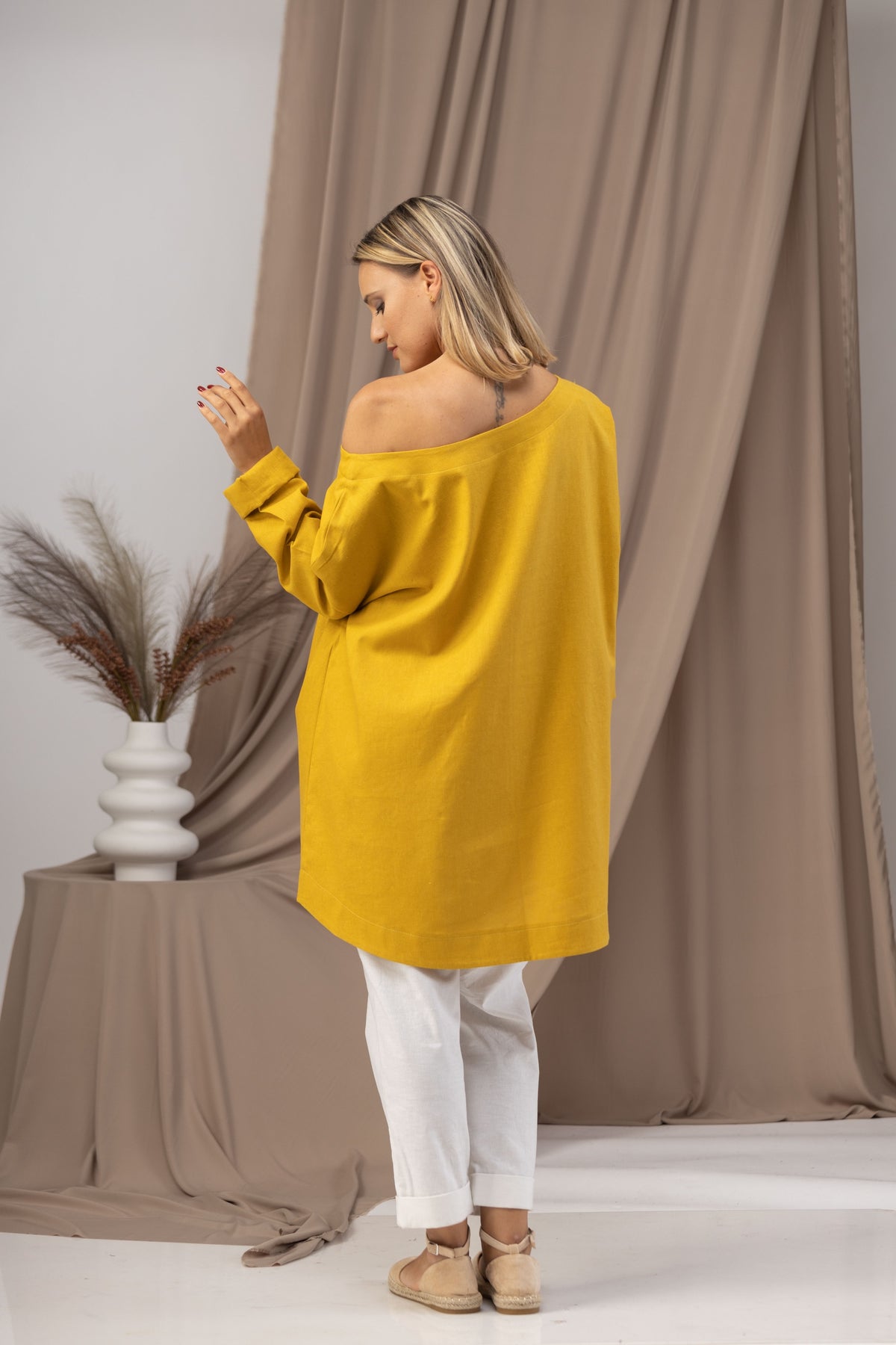 Back view of Boho-style linen tunic with open neckline

