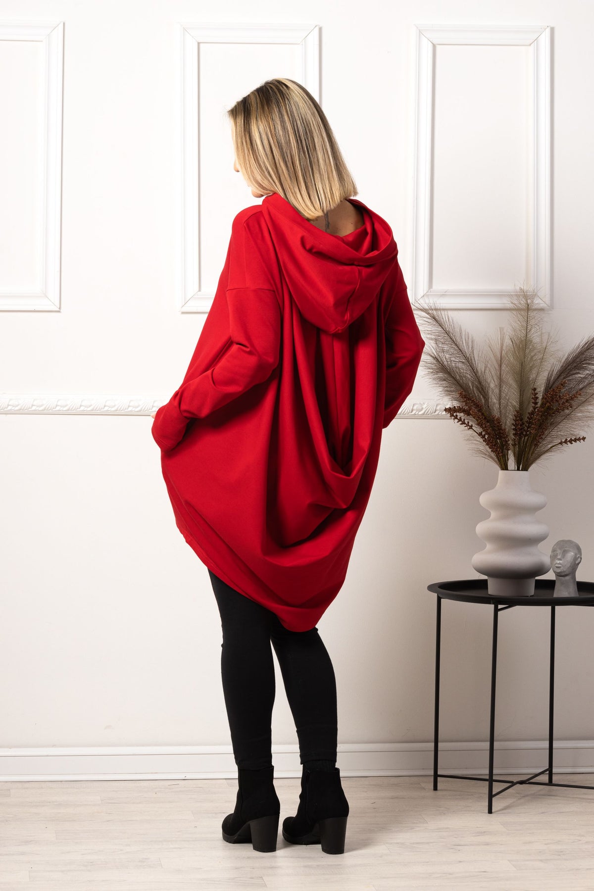 Back view of Red oversized hoodie with thumb holes